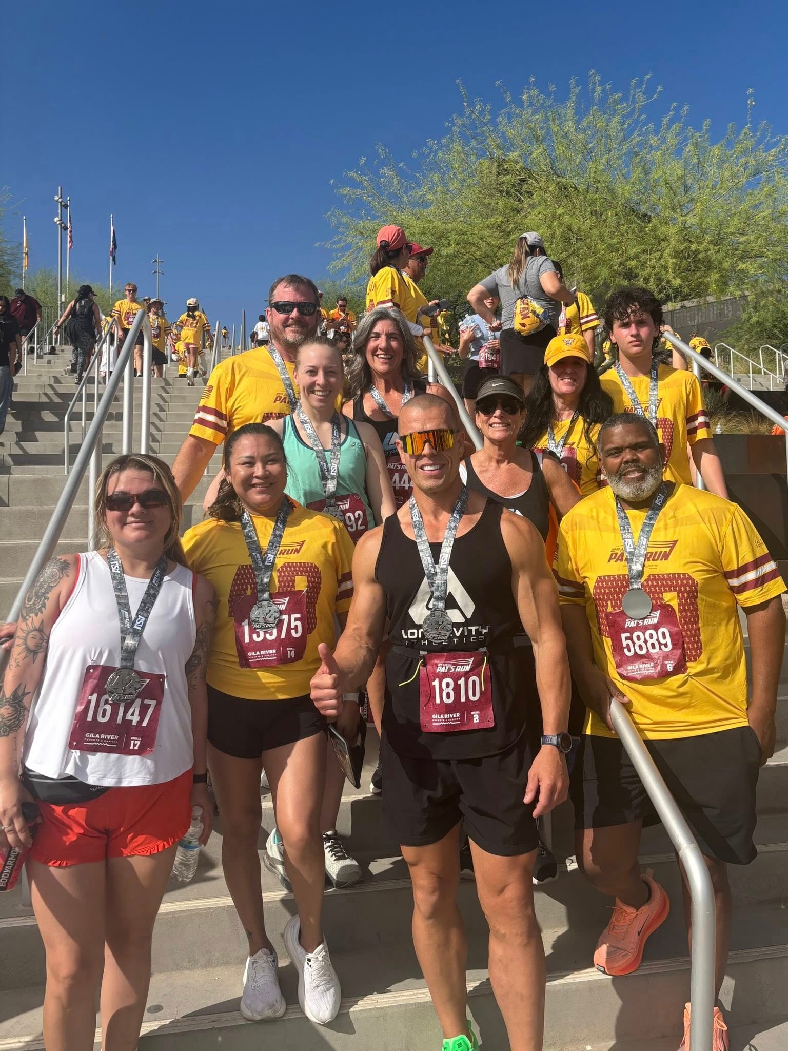 Longevity Athletics gym members celebrating together after a race in Maricopa AZ